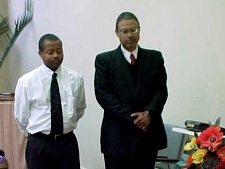 Elder Laurence E. Waller, Sr. stands by son
